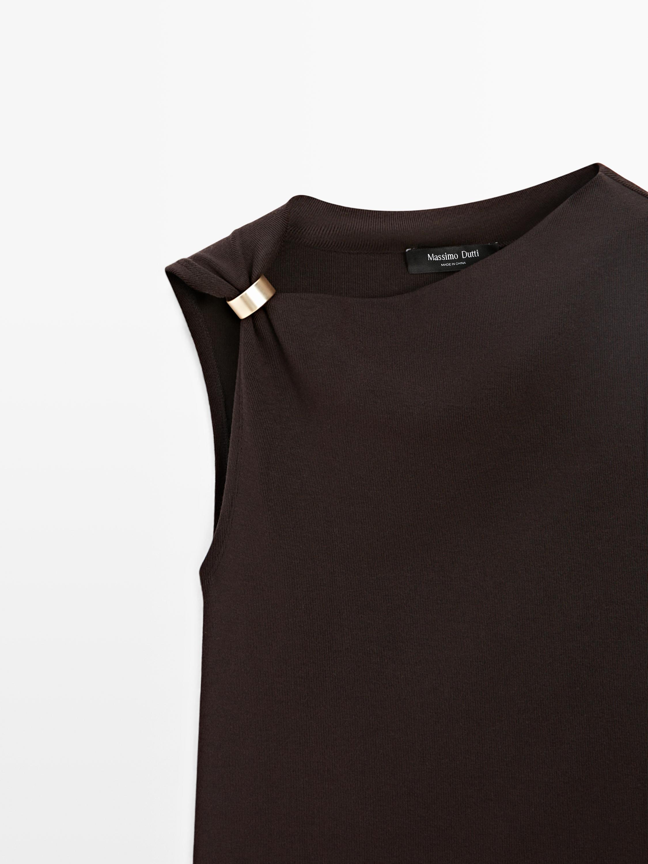 Asymmetric top with brooch detail